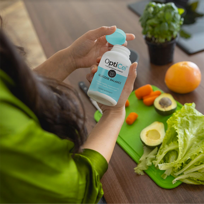 Customer holding a bottle of OptiCel