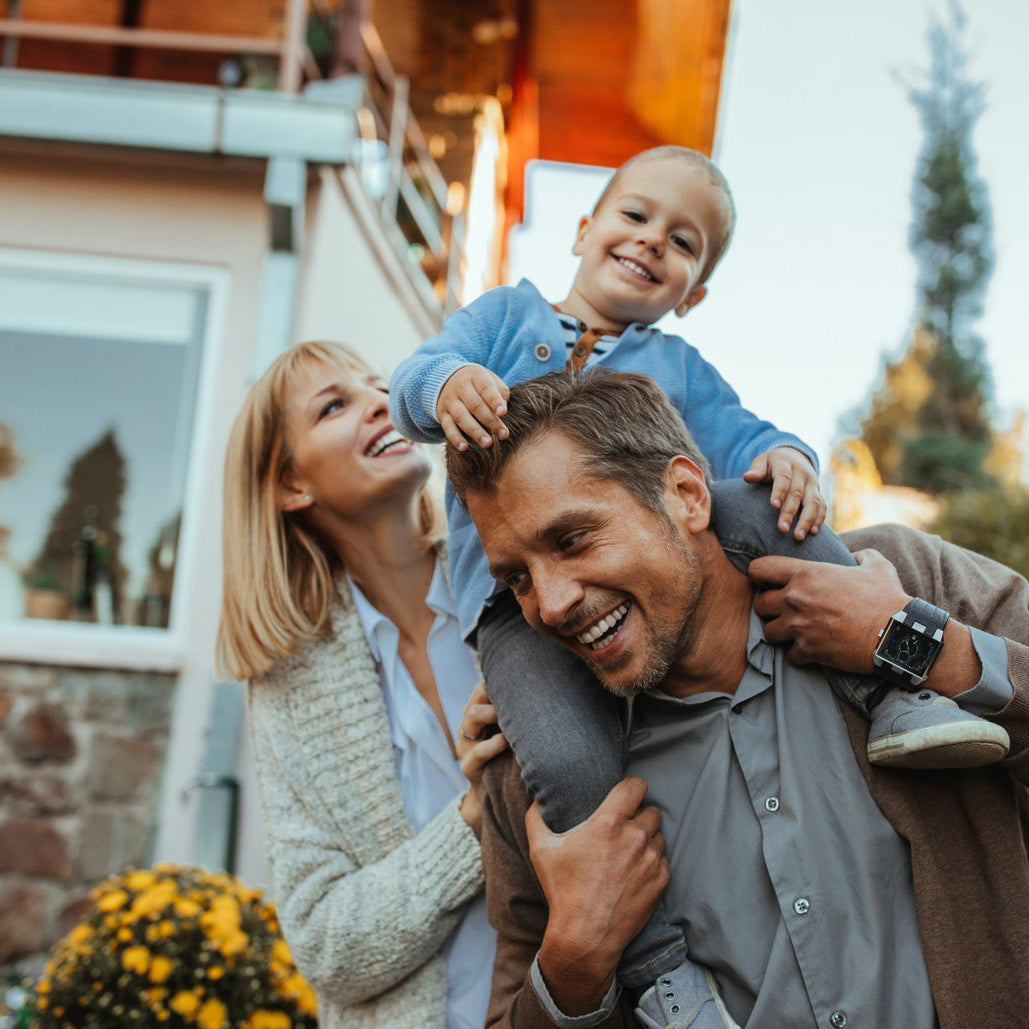 a family photo with the man carrying his child on his back